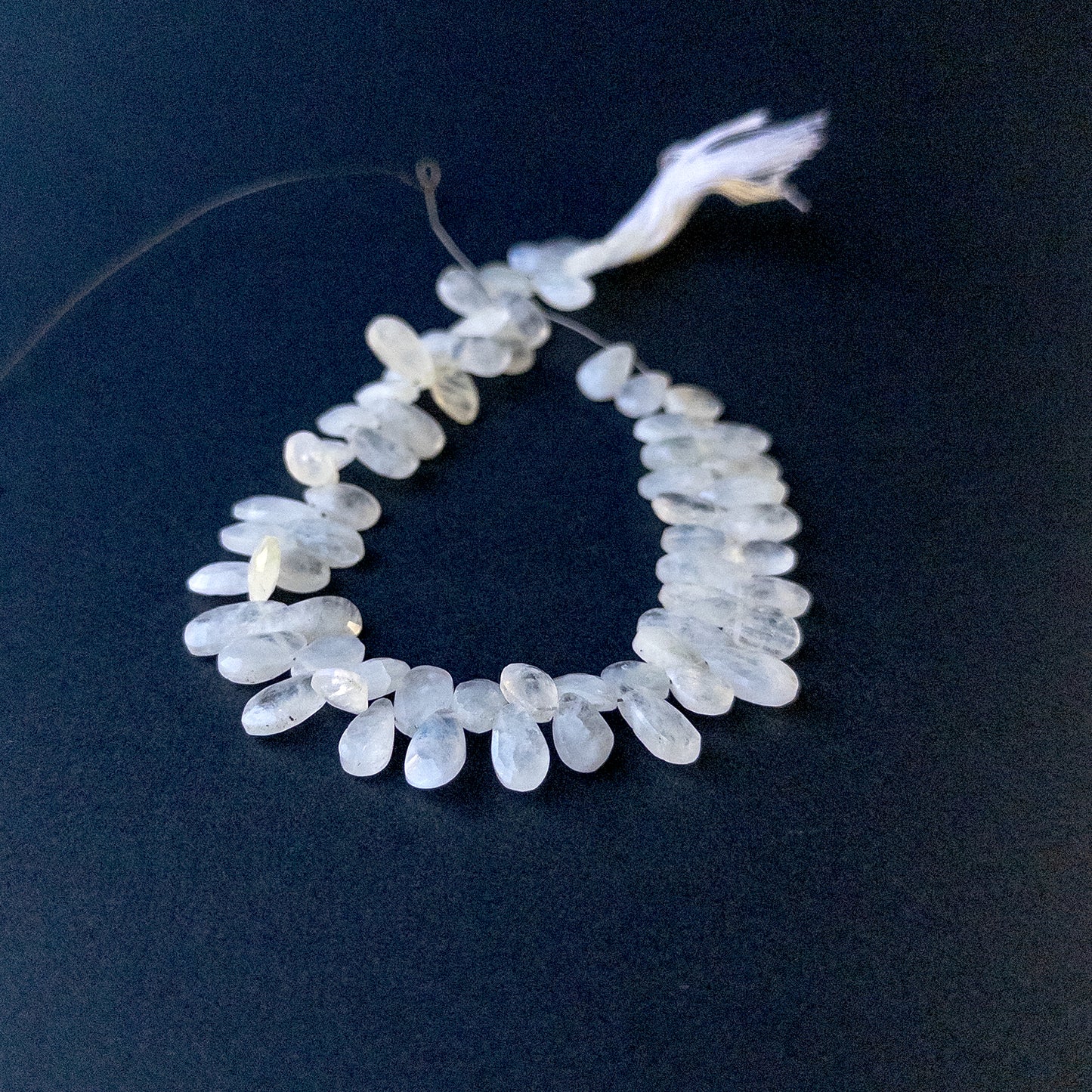 Genuine Rainbow Moonstone stone beads in faceted pear briolette cut showcasing soft sheen and high‑quality sparkle.