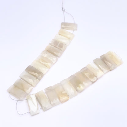 White Rainbow Moonstone faceted rectangle beads in soft white tones with iridescent shimmer.