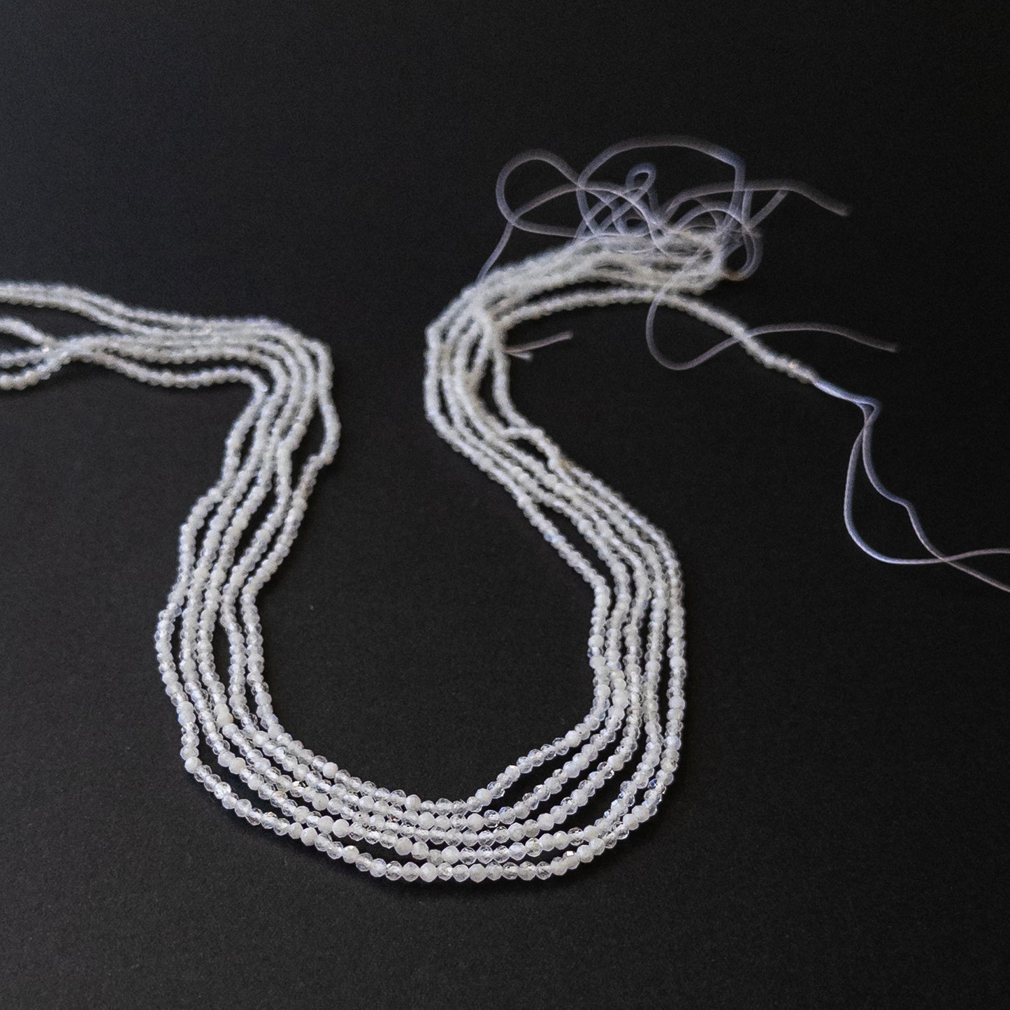 White Rainbow Moonstone faceted rondelle gemstone beads in 2.3–2.4mm on a 39cm strand for DIY jewellery.