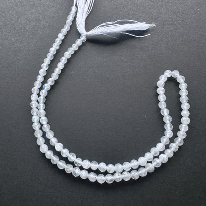 White Rainbow Moonstone faceted rondelle beads with blue flashes and polished sparkle for handmade jewellery components.