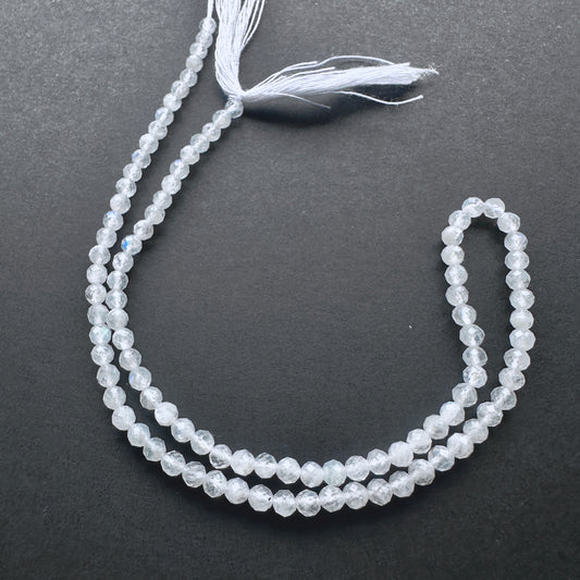 White Rainbow Moonstone faceted rondelle beads with blue flashes and polished sparkle for handmade jewellery components.