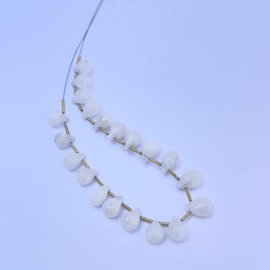 White Rainbow Moonstone gemstone beads laid out for DIY jewellery making and design inspiration.