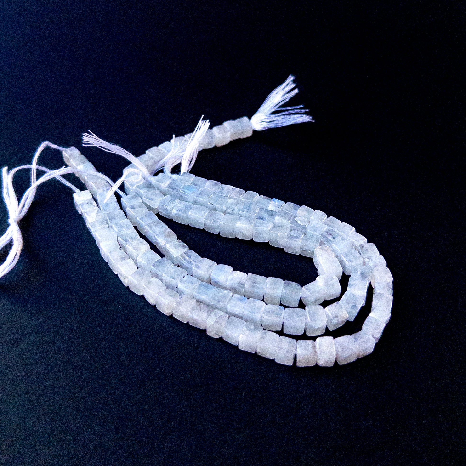 Authentic Moonstone gemstone beads showcasing smooth cube cuts ideal for handmade jewellery components.