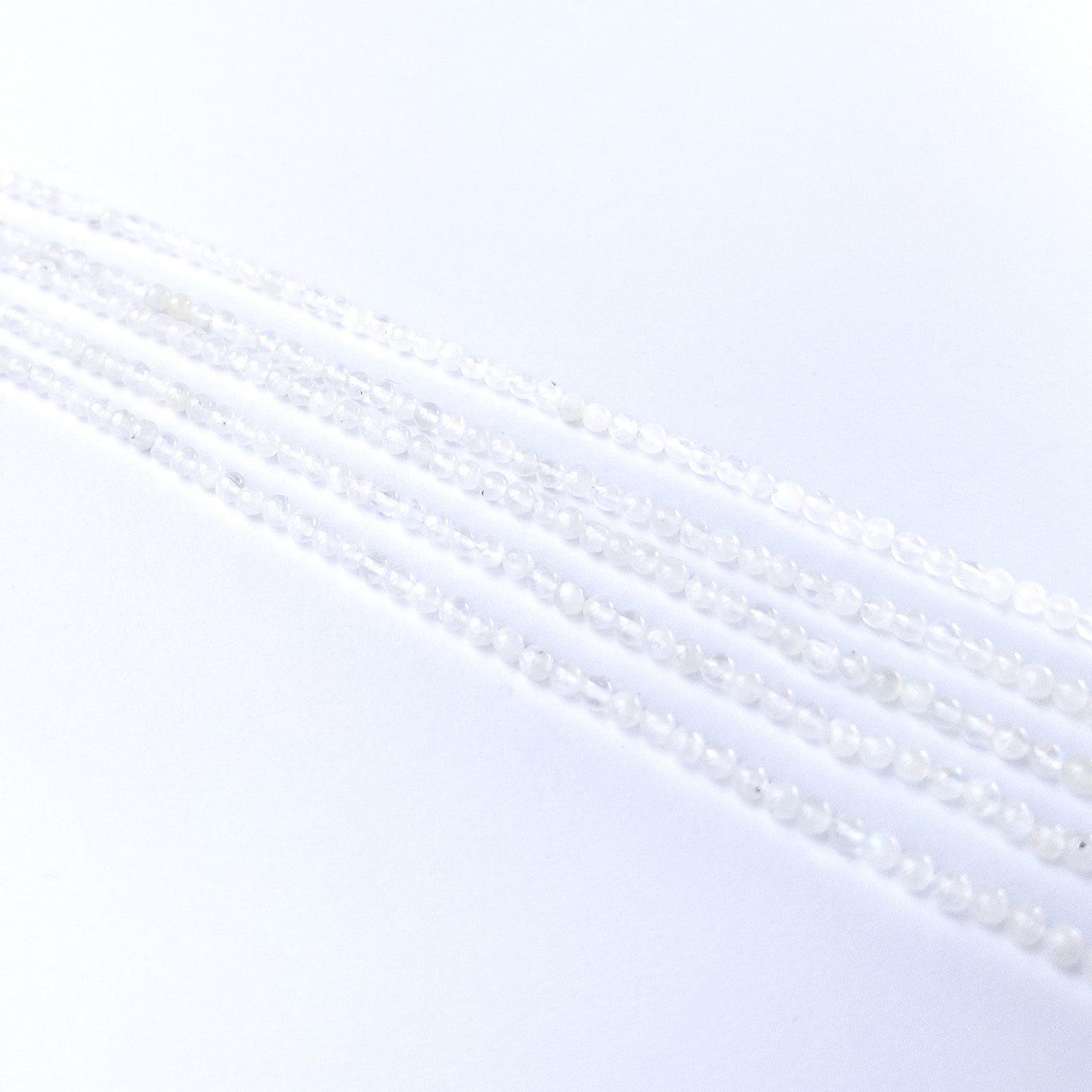 High‑quality White Rainbow Moonstone round beads with radiant white‑blue shimmer perfect for gemstone bead jewellery making.
