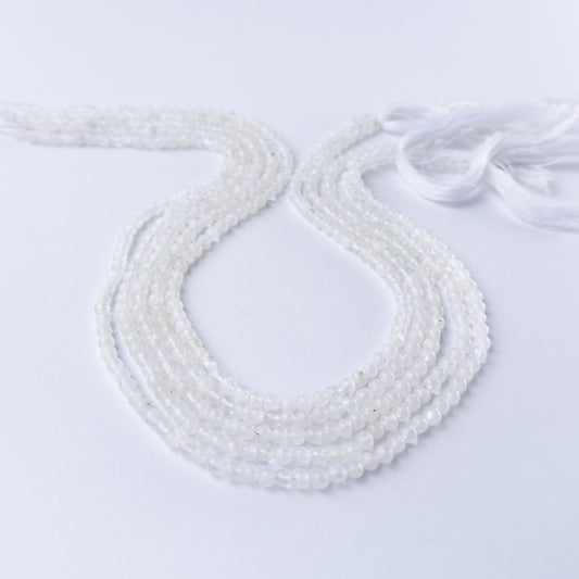 White Rainbow Moonstone smooth round gemstone beads in 3.5mm size arranged on a 33cm strand with soft glowing sheen.