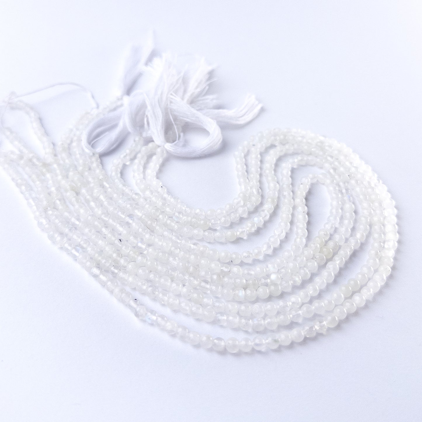 Authentic Moonstone gemstone beads showcasing smooth round cuts ideal for handmade jewellery components.
