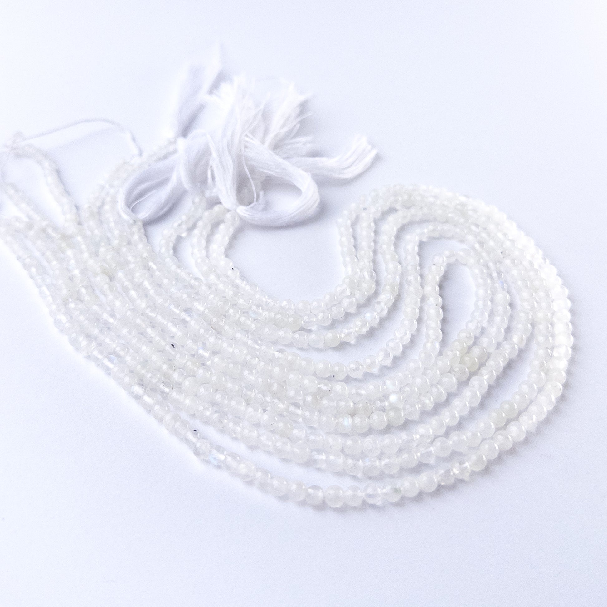 Authentic Moonstone gemstone beads showcasing smooth round cuts ideal for handmade jewellery components.