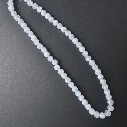Stone Beads in White Rainbow Moonstone laid out to highlight lustre and bead quality.
