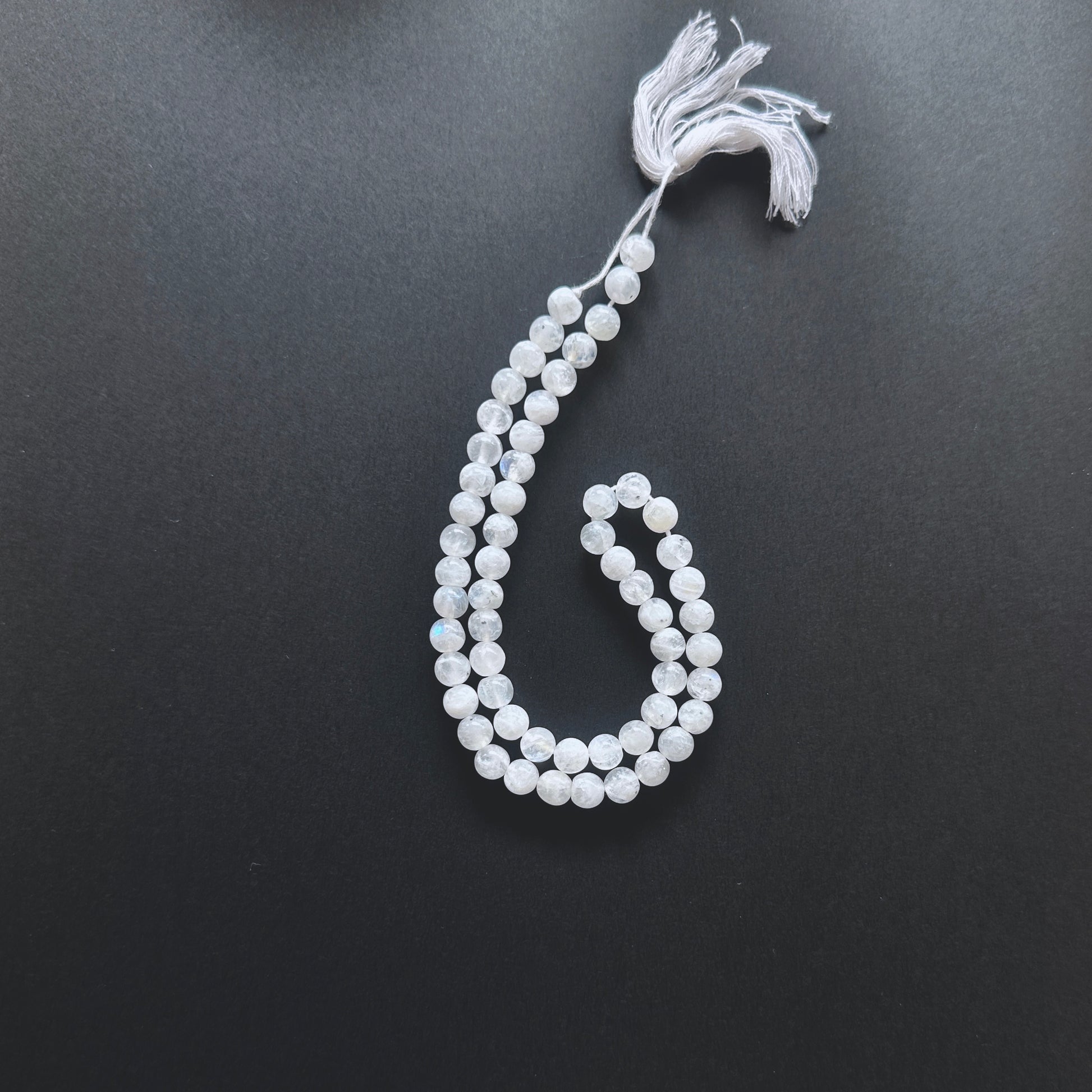 Natural gemstone beads in White Rainbow Moonstone with 6-6.5mm size and 0.5mm drilled holes.