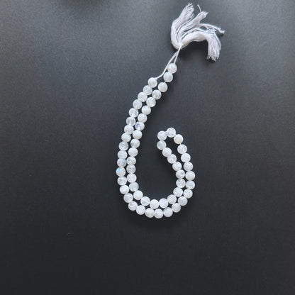 Natural gemstone beads in White Rainbow Moonstone with 6-6.5mm size and 0.5mm drilled holes.