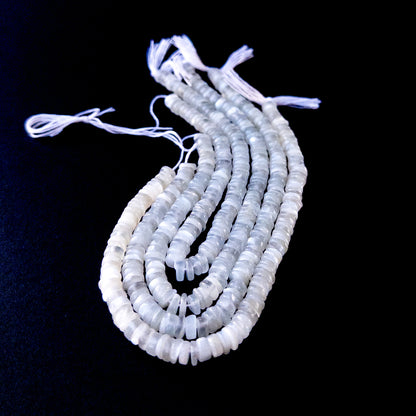 White Rainbow Moonstone smooth wheel gemstone beads in 6mm size arranged on a 20cm strand with soft glowing sheen.