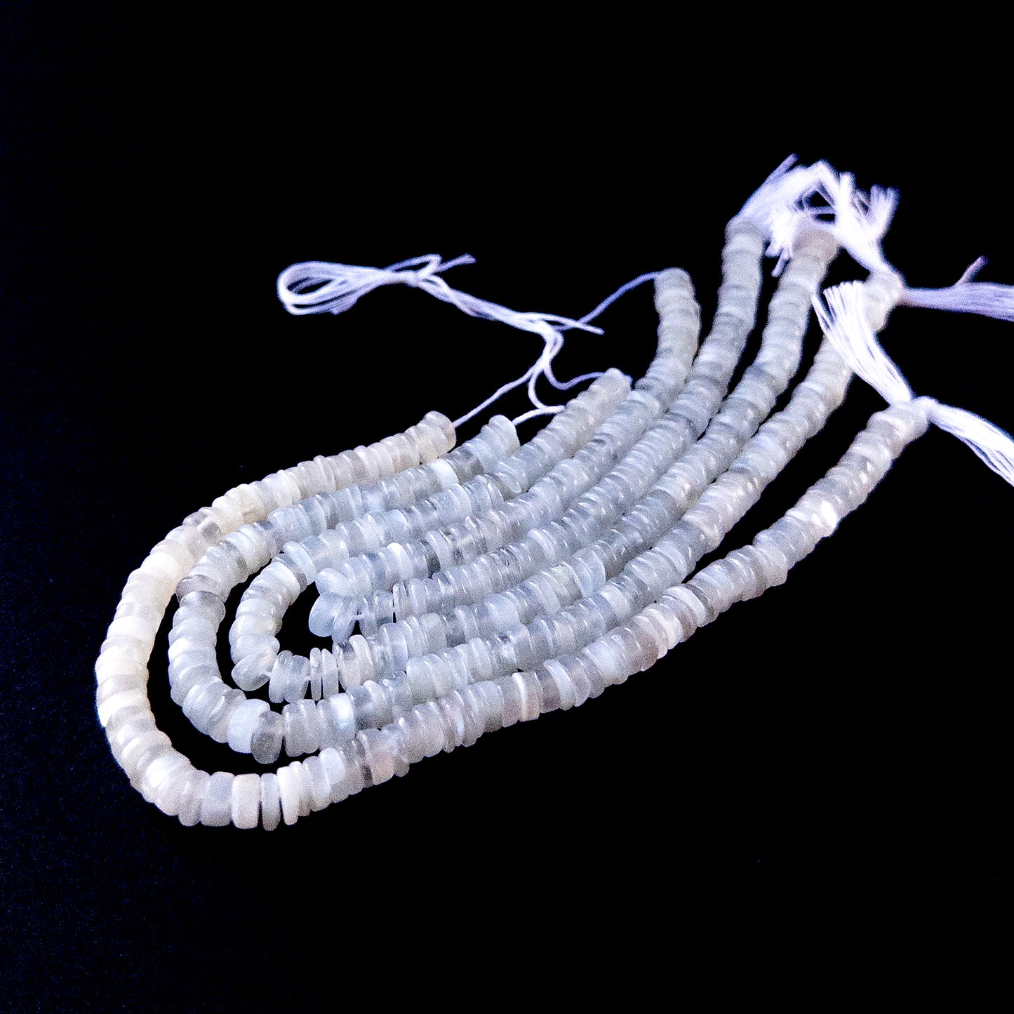 Authentic Moonstone gemstone beads showcasing smooth wheel cuts ideal for handmade jewellery components.