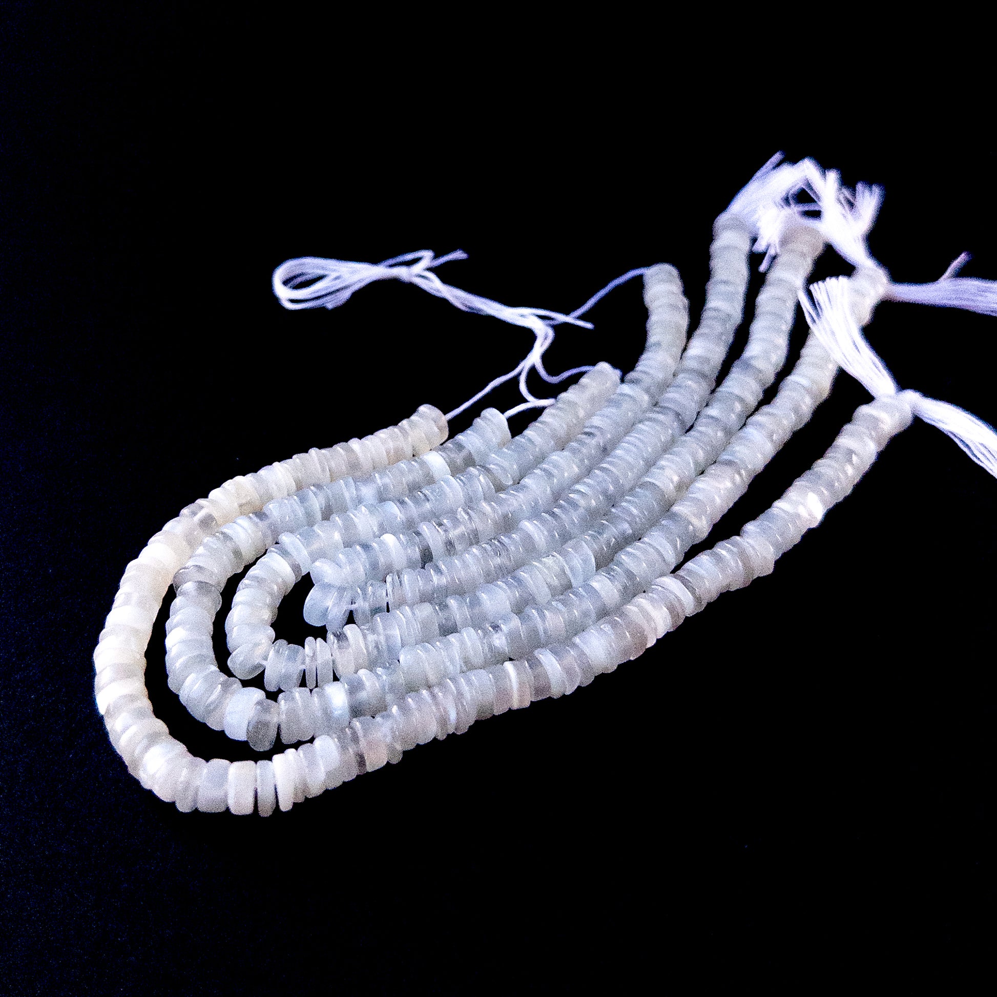 Authentic Moonstone gemstone beads showcasing smooth wheel cuts ideal for handmade jewellery components.