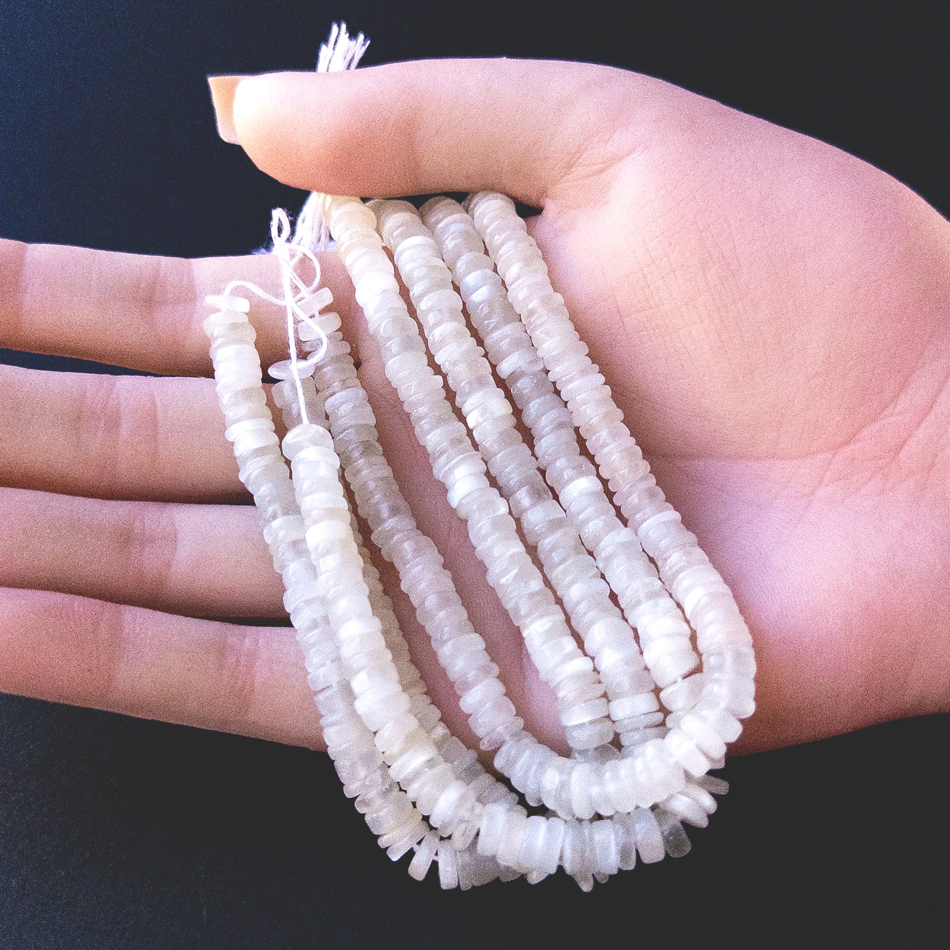 High‑quality White Rainbow Moonstone wheel beads with radiant white‑blue shimmer perfect for gemstone bead jewellery making.