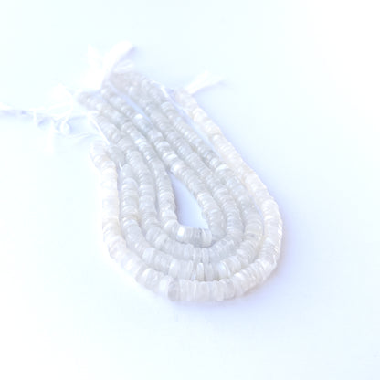 Premium Moonstone smooth wheel beads arranged neatly on a short strand with refined disc‑like shaping.