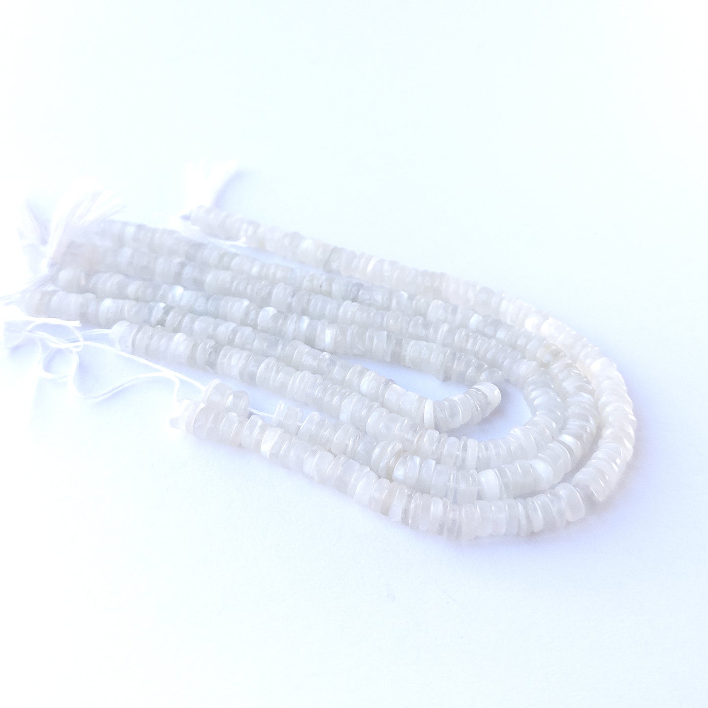 Handmade jewellery components featuring White Rainbow Moonstone wheel gemstone beads in 6mm size.