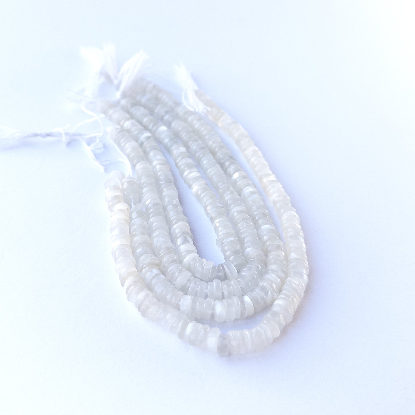 White Rainbow Moonstone wheel beads with radiant white‑blue shimmer perfect for gemstone bead jewellery making.