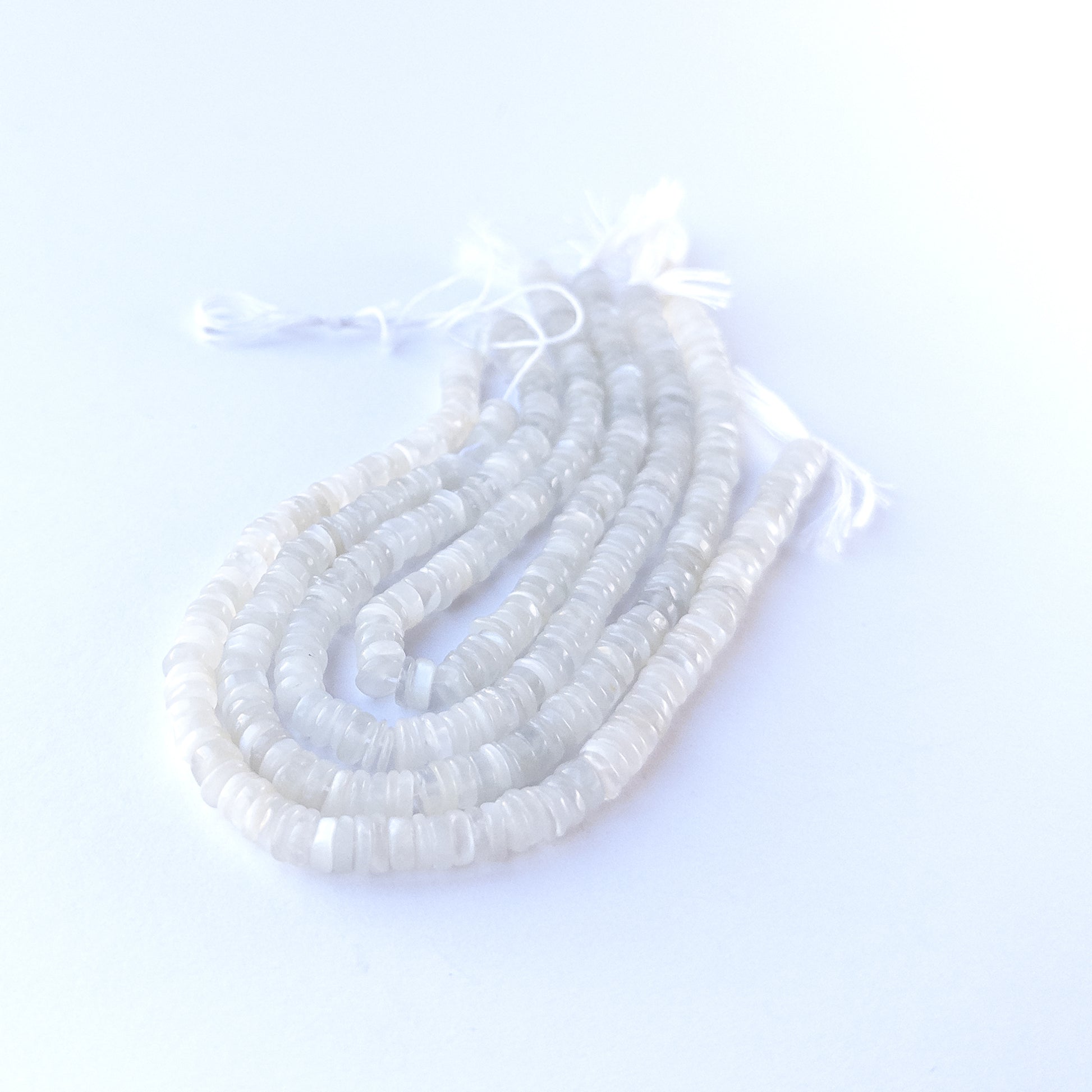 Genuine White Rainbow Moonstone stone beads for DIY jewellery featuring polished wheel shaping and luminous colour.