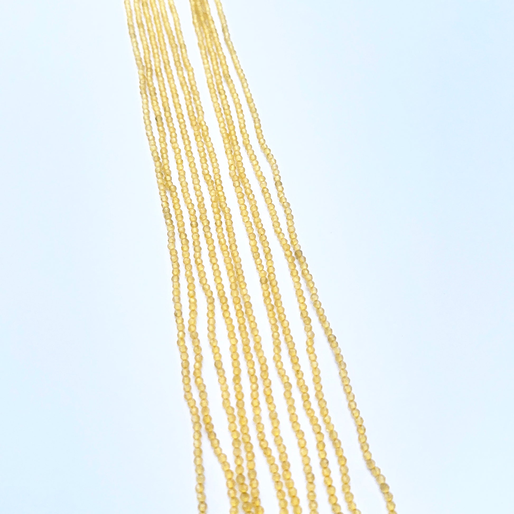 Natural chalcedony strnad featuring tiny faceted rondelles with vibrant colour.