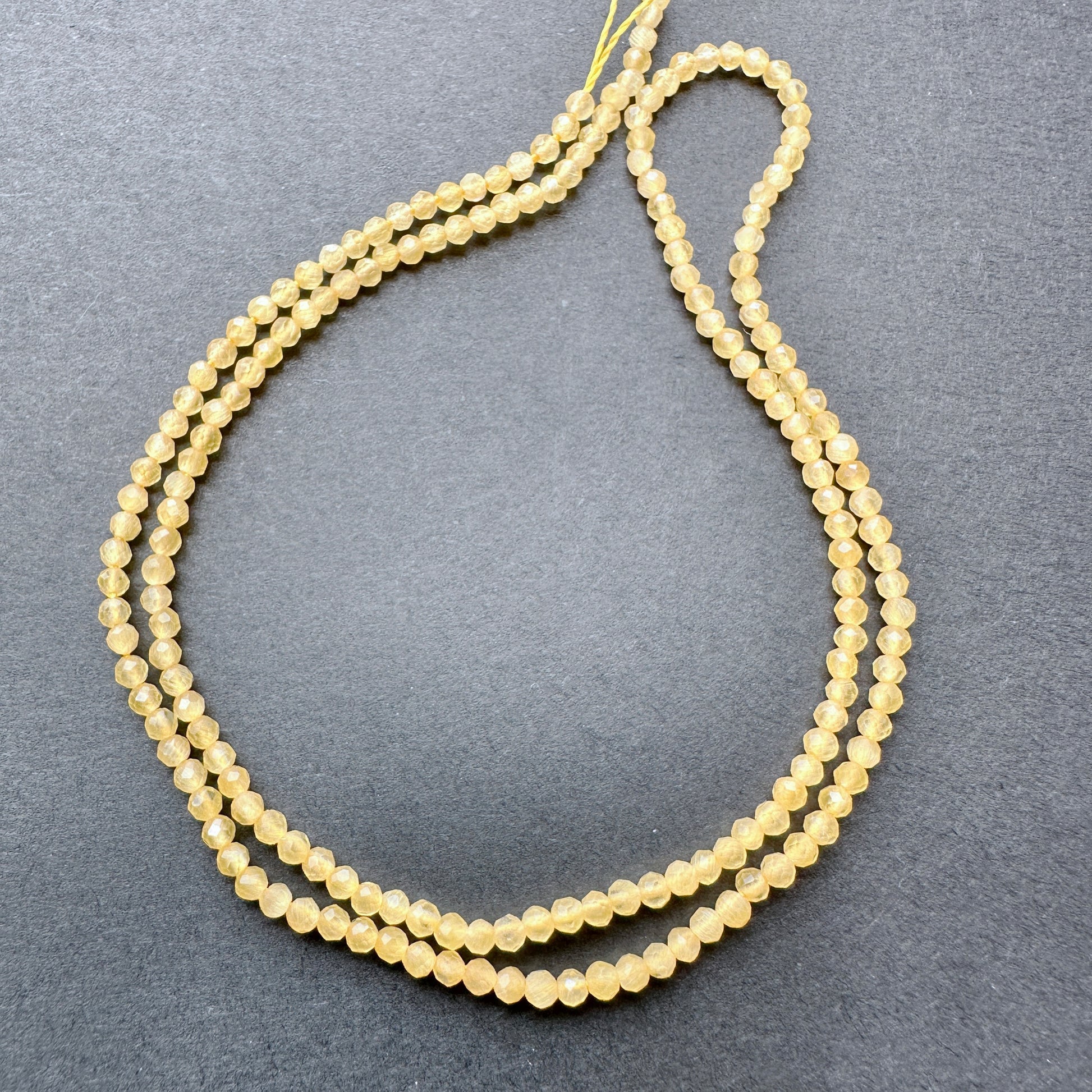 Stone Beads in Yellow Chalcedony with refined faceted rondelle cut for elegant handmade jewellery.