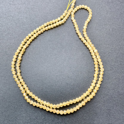 Stone Beads in Yellow Chalcedony with refined faceted rondelle cut for elegant handmade jewellery.