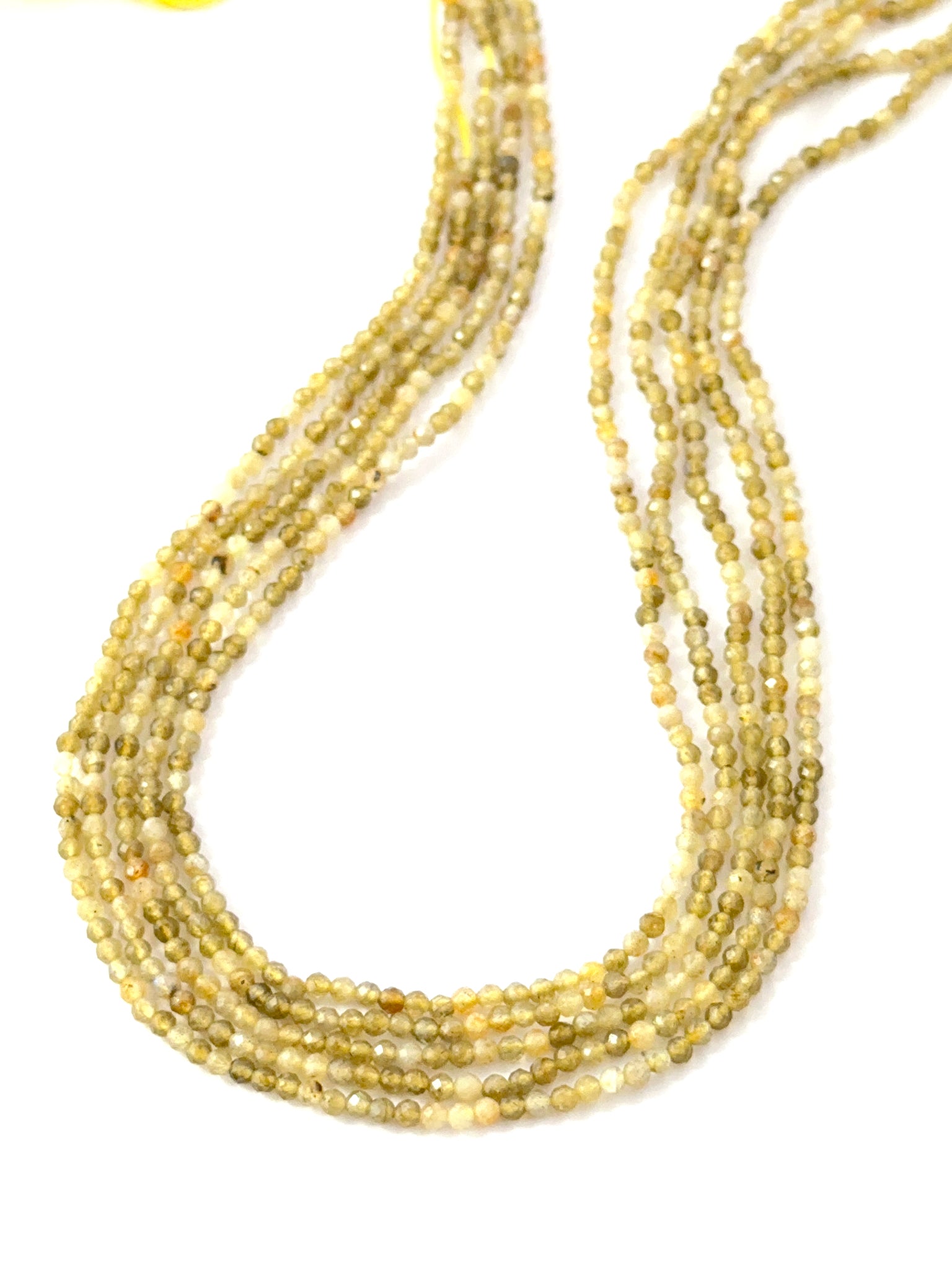 - 2.4mm faceted Yellow Opal rondelle beads on a 33cm strand for jewellery making.