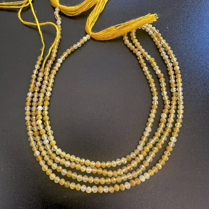 Yellow opal micro faceted rondelle beads in 2.2mm size sparkle softly across a 32cm strand.
