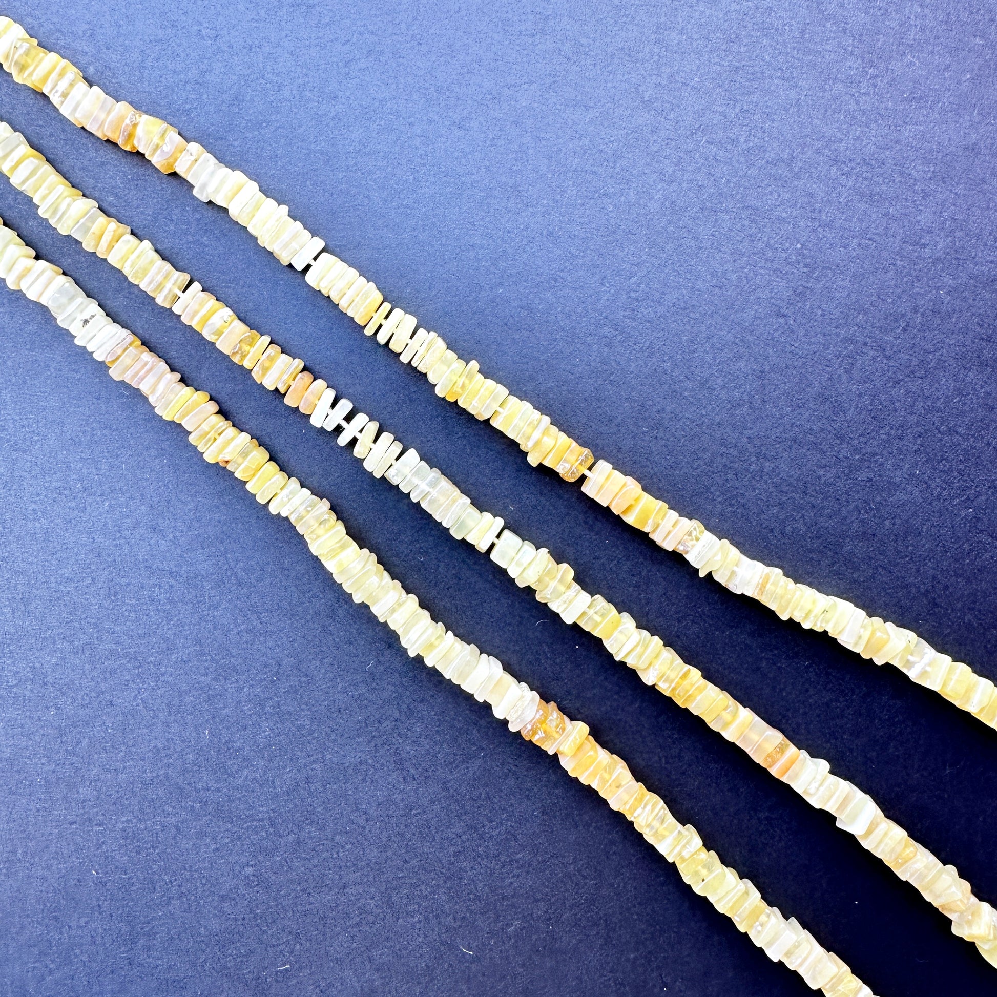 Stone beads in square shape with warm yellow tones, perfect for versatile jewellery designs and gift creations.
