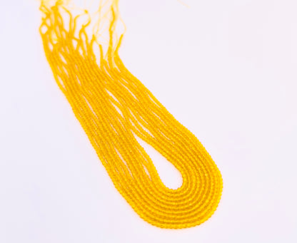 Yellow Quartz gemstone beads for jewellery making displayed with soft lighting.