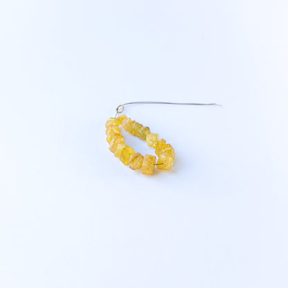 Handmade jewellery components with natural yellow sapphire drilled rough beads arranged in a 20‑piece set.